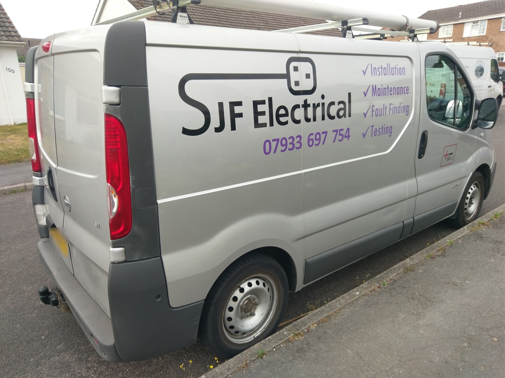The silver SJF Electrical van, lettered with Installation, Maintenance, Fault Finding and Testing