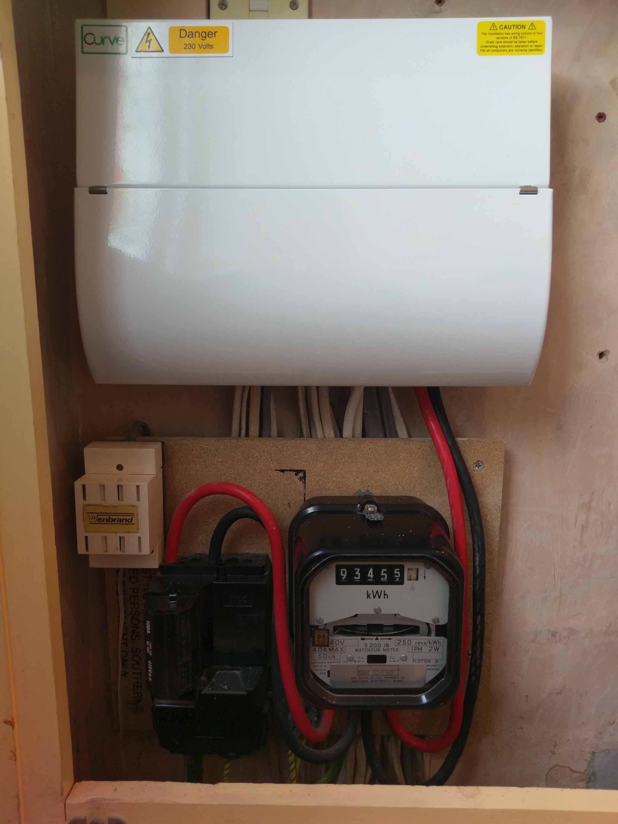 A new white consumer unit fitted above the meter board